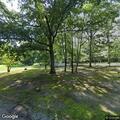 Car driving through yard damages light pole