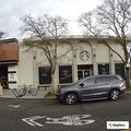 Car crashes into business, man hurt on sidewalk