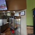 Person banging on counter at Pizza Guys
