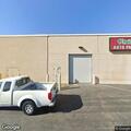 Traffic stop on black Mercedes at auto parts store