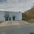 Person experiencing chest pains at fitness center