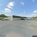 Vehicle crash with trailer rollover near store