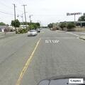 Woman throwing objects at cars on Grand Avenue