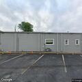Person appearing confused and unwell outside Caseyville business