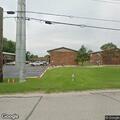 Caller reports unknown officer at front door