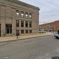 Woman reports battery at police station