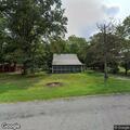 Small bonfire behind abandoned church reported