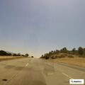 Slow-moving black Jaguar on Highway 101