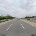 Stranded driver with flat tire on I-270 shoulder