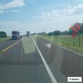 Car in ditch along Highway 156 near Third Street