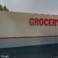 Traffic stop on white Mitsubishi near Grocery Outlet