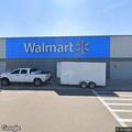 Youths taking photos of vehicles at Walmart lot
