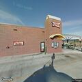 Older male suffers severe back pain at restaurant