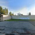 Older male slouched over in vehicle at Roseville Laundry