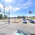 Two cars racing at high speed on West Florissant