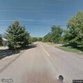 Man breaking tree branches on Crest Ridge Avenue