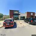 Officer checks occupied vehicle in parking lot