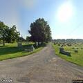 Officer checks suspicious car at cemetery