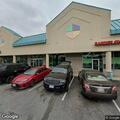Woman tampering with vehicle at laundry business
