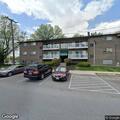 Man knocking and calling child outside at apartment