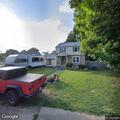 Men reported behind home talking about lone neighbor