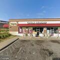 Report of gray SUV blocking driveway at liquor store