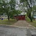 Burning trash reported in backyard on Lowell Avenue