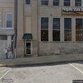 Person loitering and talking to self outside bank