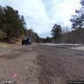 Disabled SUV leaves Bigfoot sign area on mountain road