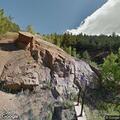 Person hanging from SUV roof on Pikes Peak Highway