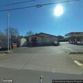 Adult female cuts leg on chair at gas station