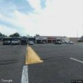 Man pulling woman from car at fast-food parking lot