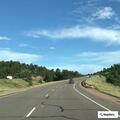 Minivan with trailer crashes off West Highway 24
