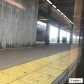 Person with back pain at New Carrollton Metro Station
