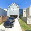Man looking into open garages on John Dabb Court