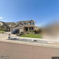 Woman pacing outside house on Mount Harvard Drive