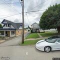Three vehicles blocking alleyway access to carport