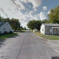 Person walking on railroad tracks near Meadow Street