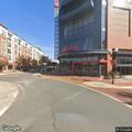 Man swinging bottle and shoving person in parking lot