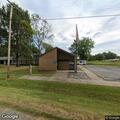 Vehicle hits post office building in Dow