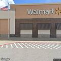 Person ill in red car at Walmart parking lot