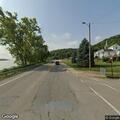 Traffic stop on red Dodge Caliber near water tower