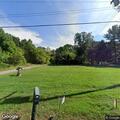 Motorcycle crash with person trapped under bike