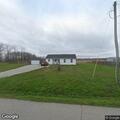 Report of men and trucks near West Versailles Street in Holton