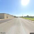 Person walking in middle of roadway on Truman Road