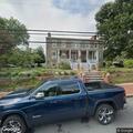 Police investigate damage to gray Jeep Cherokee
