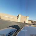 Person lying on ground near Walmart sign in Carson City