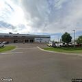 Ambulance picks up patient from hangar for transport