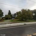 Officer checks camp behind Garden Avenue home