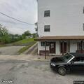 Vehicle crashes into laundromat, people trapped